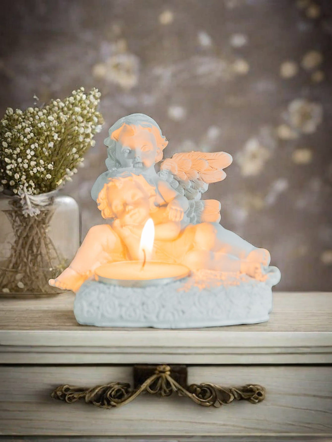 Add a celestial touch to any occasion with our Angelic Tea Light Candle Holder. Made with quality materials, this heavenly piece exudes elegance and grace. Its intricate design allows for soft candlelight to gently illuminate any space. Perfect for weddings, holidays, or a serene atmosphere in any room.