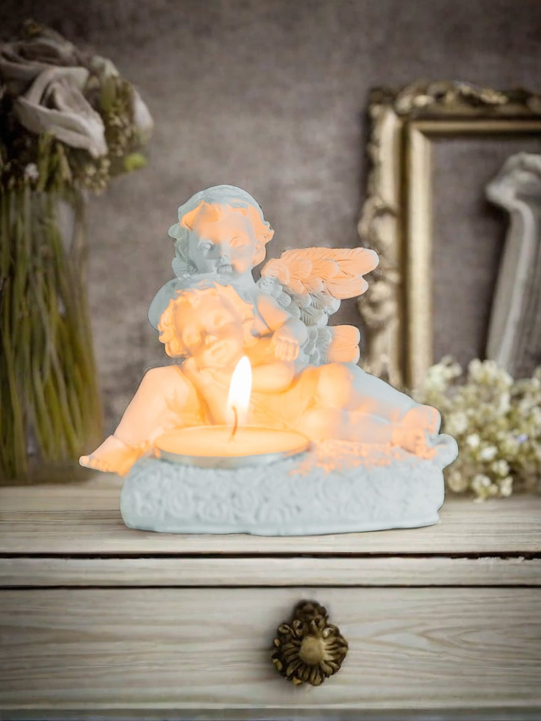 Add a celestial touch to any occasion with our Angelic Tea Light Candle Holder. Made with quality materials, this heavenly piece exudes elegance and grace. Its intricate design allows for soft candlelight to gently illuminate any space. Perfect for weddings, holidays, or a serene atmosphere in any room.