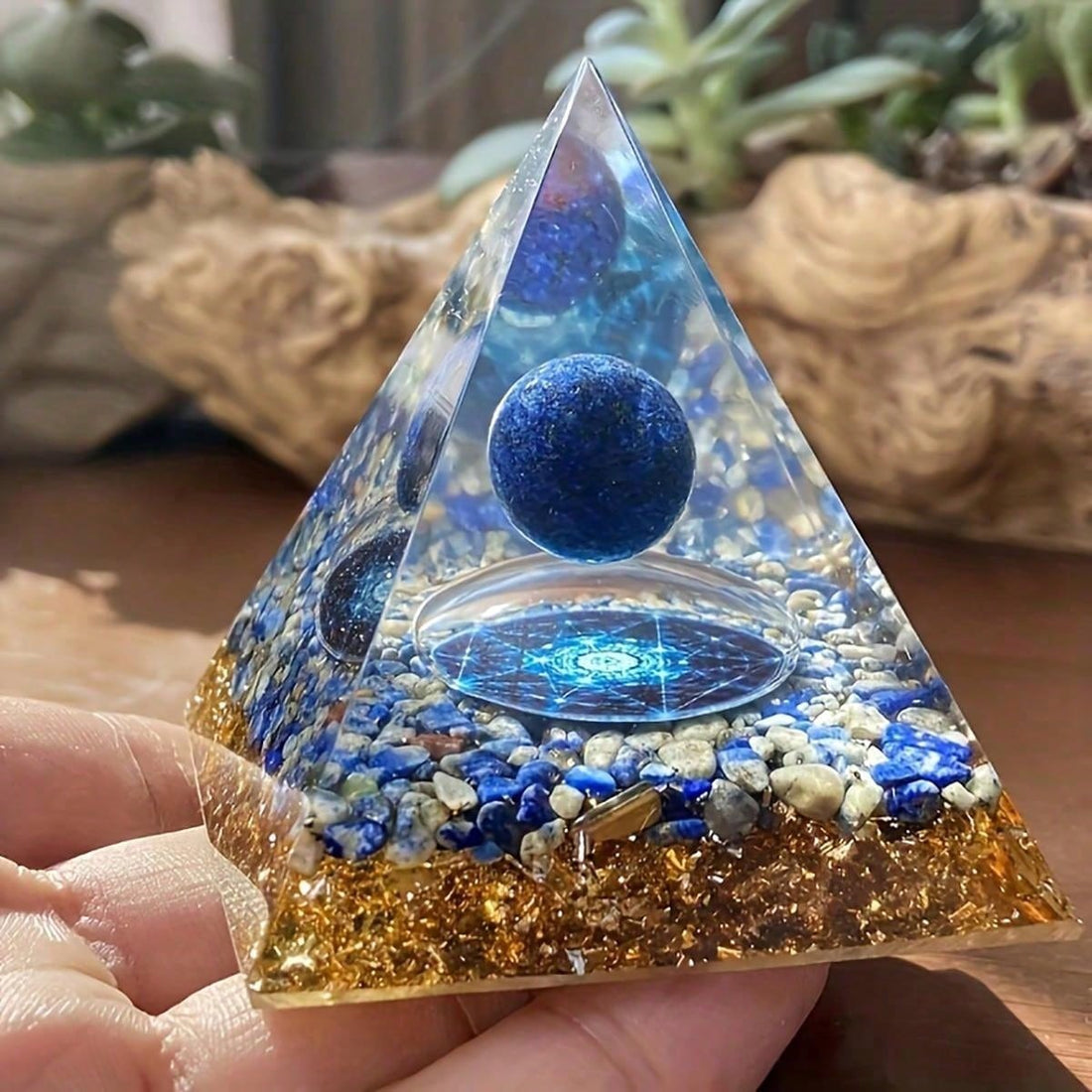 Elevate your space with the Lapis Lazuli Positive Energy Pyramid. Crafted from natural epoxy, this desk decoration radiates positive energy and promotes a sense of calm and balance. Perfect for any workspace, it adds a touch of beauty and serenity to your day.