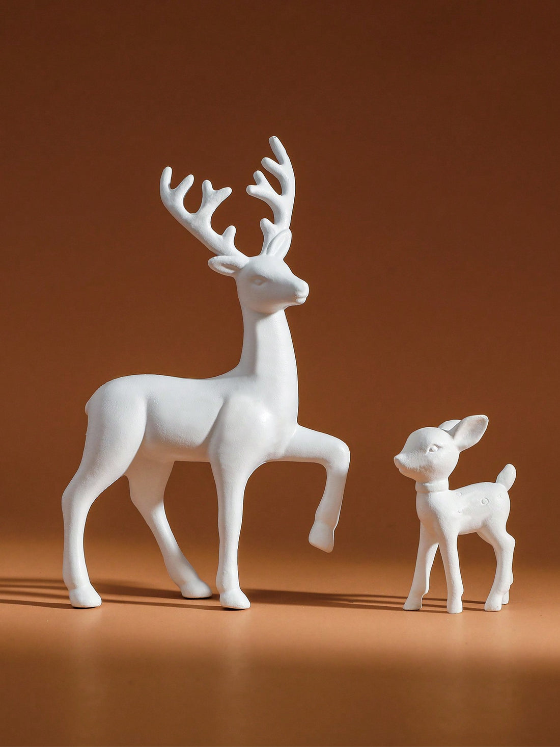 This charming Adorable Deer Family Sculpture Set is the perfect addition to your Christmas home decor. Crafted with intricate detail, these table ornaments bring a touch of woodland magic to any room. Made of durable materials, this set is not only beautiful but also long-lasting. A must-have for any holiday enthusiast.