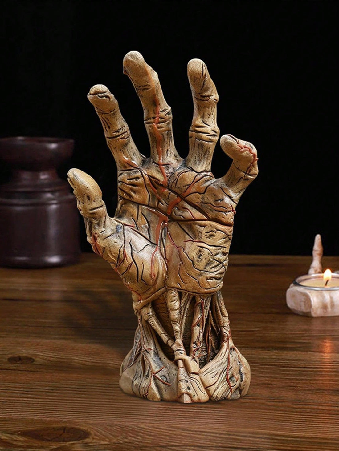 Enhance your Halloween decorations with our Gothic Hand Resin Decoration. This perfectly terrifying desk ornament adds a unique and eerie touch to any aesthetics. Made from high-quality resin, it's a durable piece that will spook your guests for years to come.