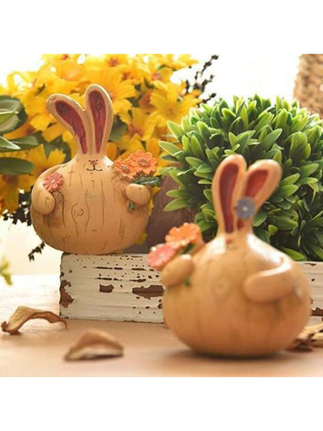 Enhance the charm of your home, indoors and outdoors, with our Vintage Resin Rabbit Statues. Crafted with exquisite detail, these statues will add a touch of whimsy to any space. Made from durable resin, they are perfect for both indoor and outdoor use.