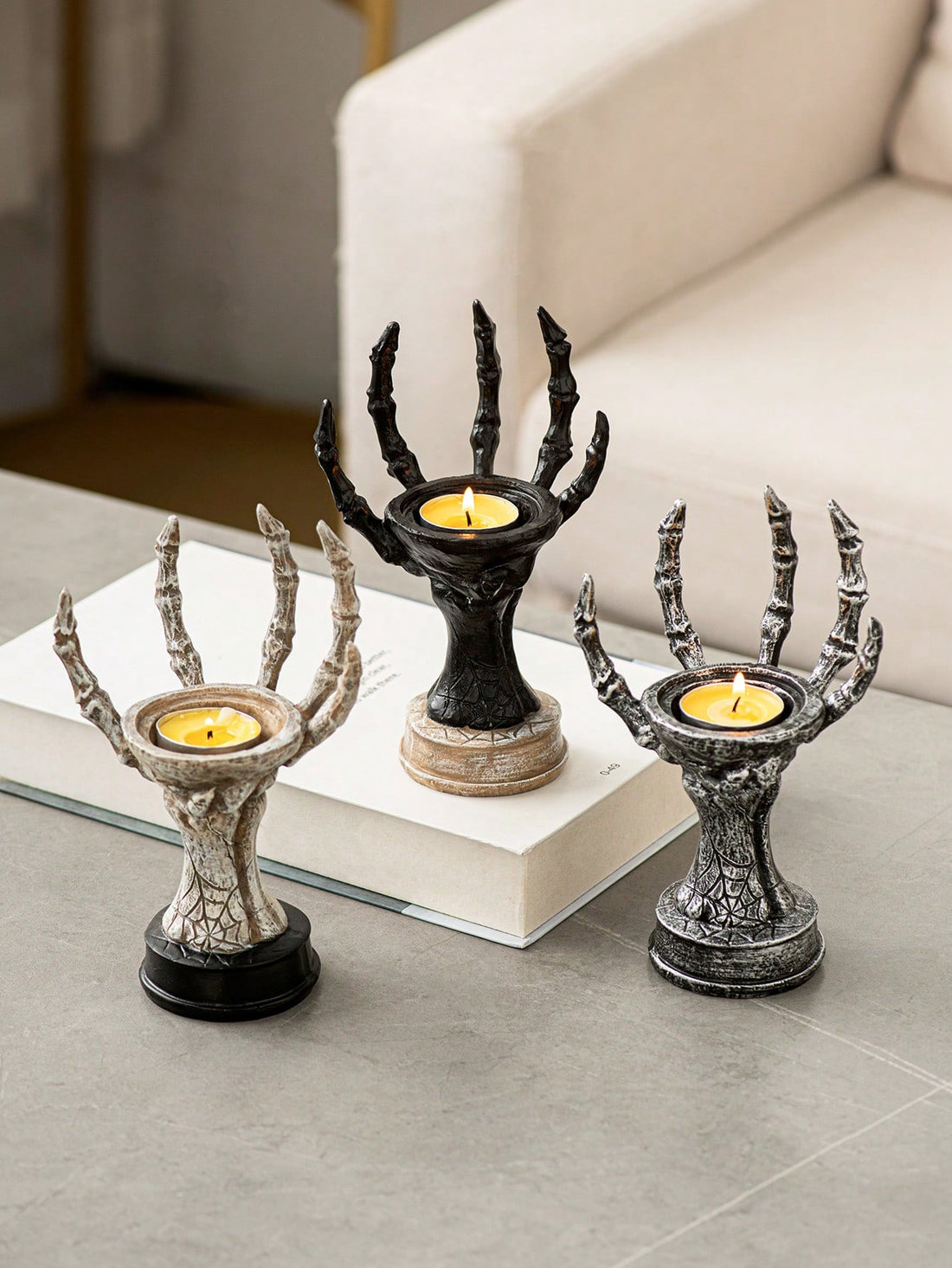 This vintage resin ghost hand candle holder from Spooky Chic adds a unique and eerie touch to your Halloween decor. Crafted with intricate details, it's perfect for holding your favorite spooky candle while creating a haunting ambiance. Elevate your holiday decorations with a touch of vintage charm.