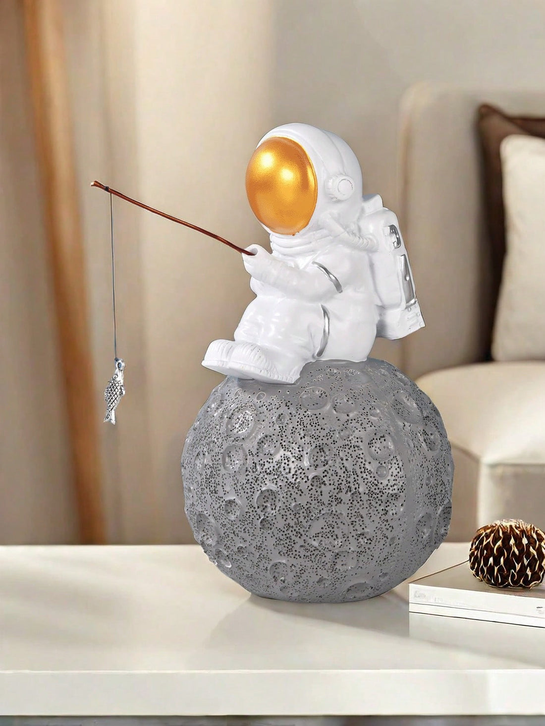 This stunning Silver Spaceman Sculpture is a must-have addition to any home decor collection. Crafted with detail in mind, its sleek design adds an astronomical touch to any space. Made with high-quality silver, this sculpture is not only visually appealing but also durable. Elevate your home decor with this unique piece.