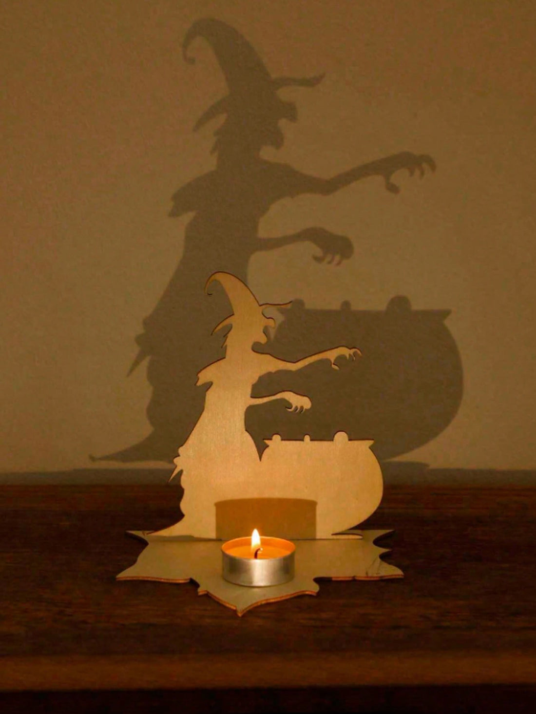 Illuminate your Halloween decor with our Spooky Shadow Ghost Candle Holder. Perfect for both indoor and outdoor use, this horror-inspired piece will add an eerie touch to any space. The detailed design casts chilling shadows, creating a truly haunting ambiance. Make your Halloween festivities unforgettable with this must-have decoration.