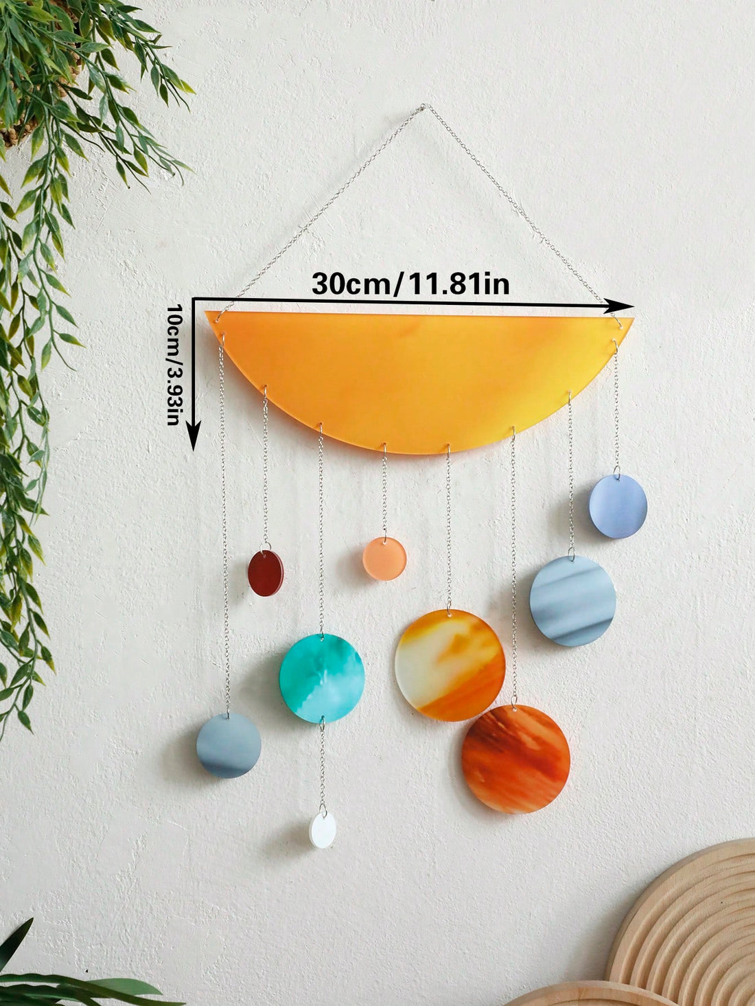 This colorful geometric mobile is a modern piece of acrylic wall hanging decor perfect for both home and office settings. With its vibrant colors and unique design, it adds a touch of art and sophistication to any space. Handcrafted and versatile, it makes a great addition to any modern interior.