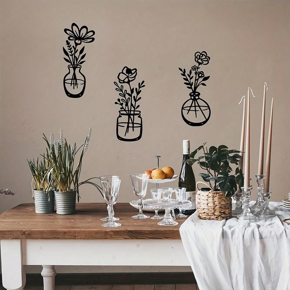 This set of 3 elegant black floral metal wall art pieces will add a touch of chic minimalism to any room. With intricate flower designs, these pieces are the perfect addition to any home decor. Elevate your space with this stylish and sophisticated set.