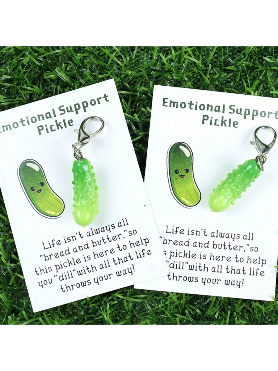 Introducing the Emotional Support Pickle Keychain: the perfect gift for any occasion! This fun and uplifting keychain will bring a smile to anyone's face, providing a much needed emotional boost whenever it's needed. Made with high-quality materials and designed to last, this keychain is a thoughtful and unique way to show someone you care.