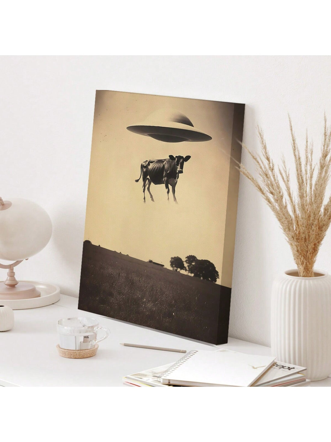 Add a distinctive touch to your bedroom or living room with the Retro UFO Cow Canvas Poster. This unique wall art combines nostalgic retro design with a whimsical UFO theme, creating an eye-catching focal point. Printed on high-quality canvas, it ensures vibrant colors and durability, making it an ideal choice for enhancing your home decor with a blend of humor and style.