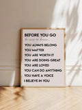 Natural wood framed Before You Go affirmation print in a sunlit room