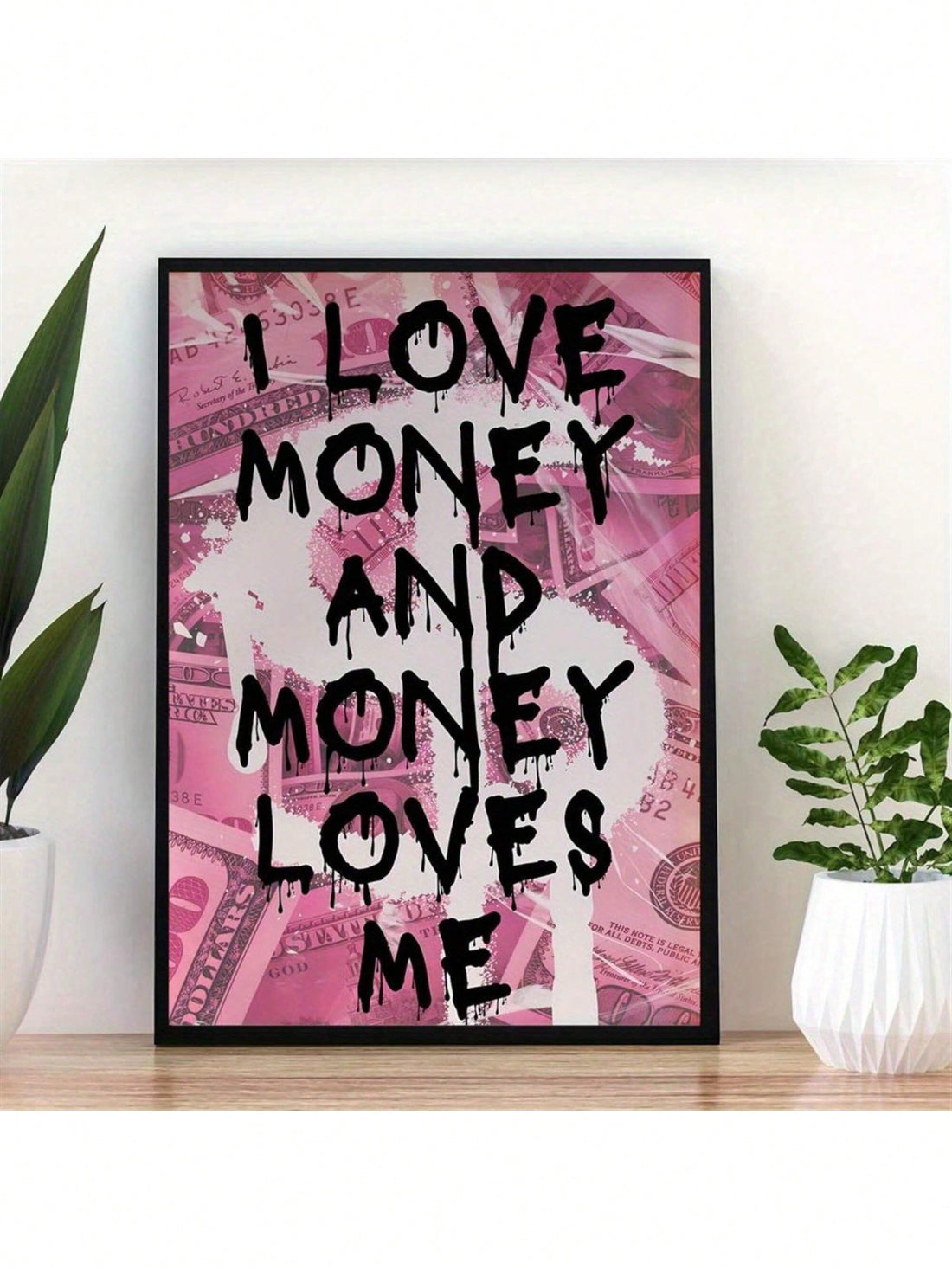 Elevate your wall decor game with this trendy pink graffiti canvas art! Featuring a bold money slogan, this unframed piece adds a touch of edginess to any room in your home or office. Show off your unique style and make a statement with this eye-catching artwork.