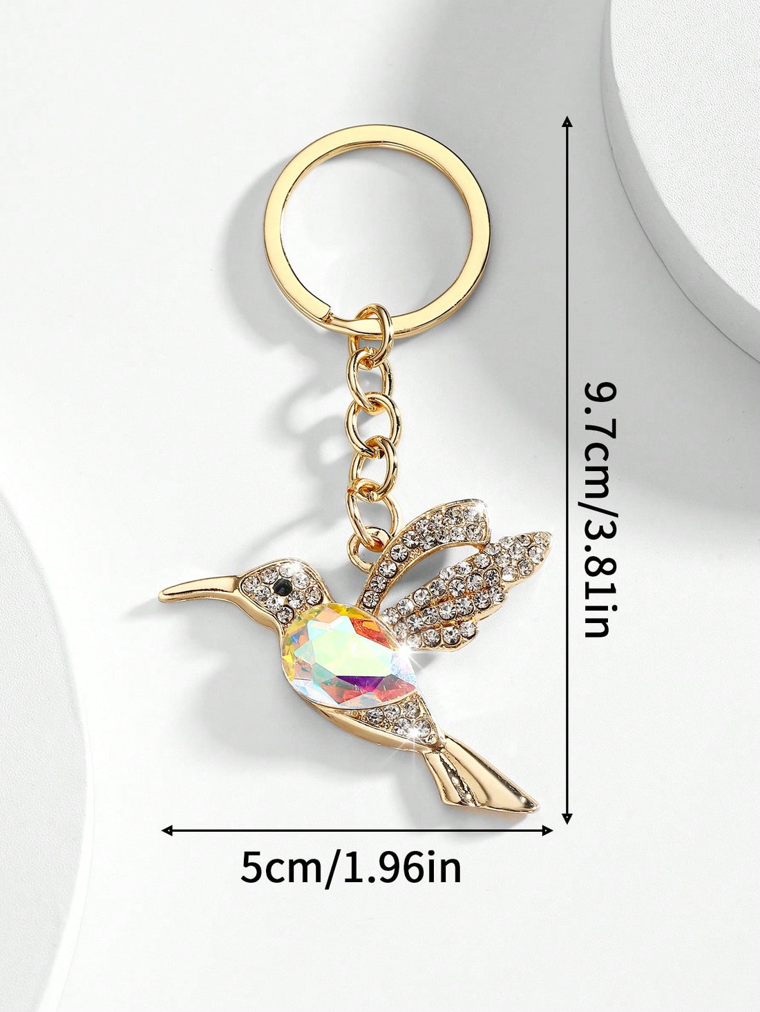 Add a touch of European-American style to your purse with our Elegant Crystal Hummingbird Keychain. Made with high-quality crystals, this keychain is not just a stylish accessory but also a durable and practical one. Elevate your style and stay organized with this elegant keychain.