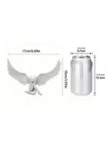 Soda can comparison showing scale of wing shaped craft ornament.