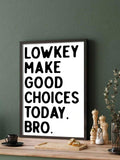 Dark framed Lowkey Make Good Choices Today print in a green kitchen