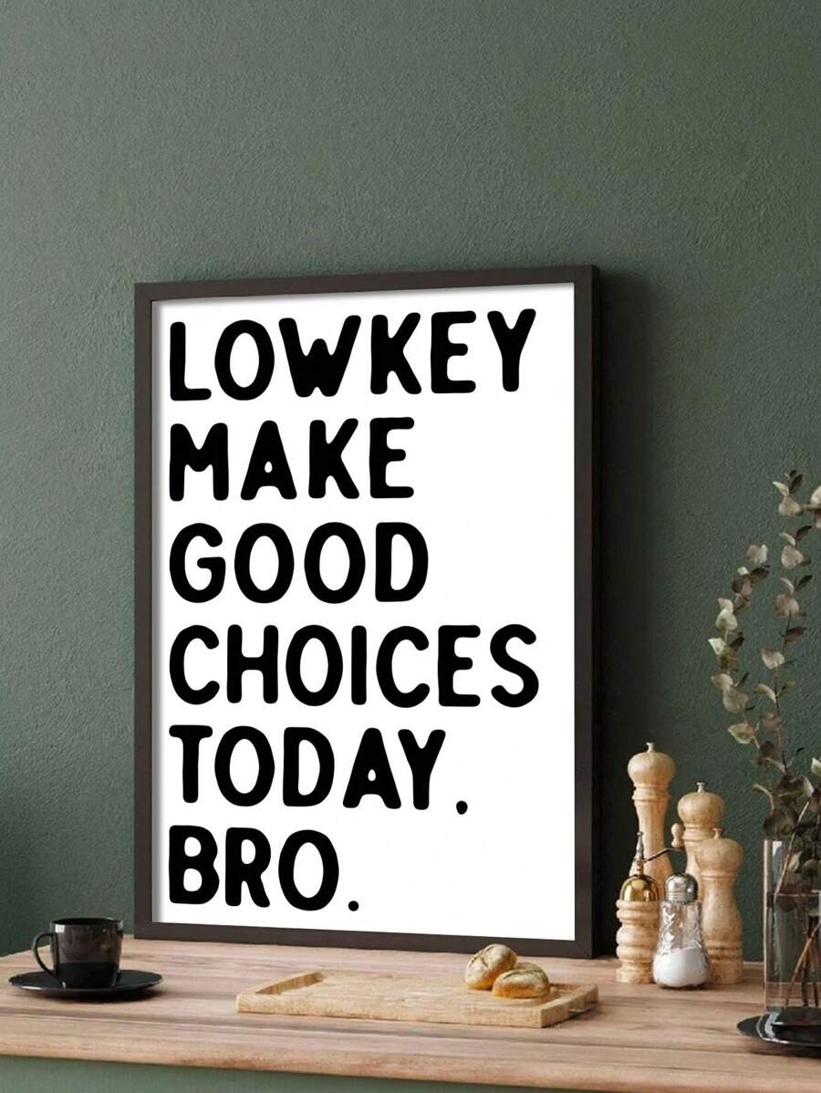 Dark framed Lowkey Make Good Choices Today print in a green kitchen