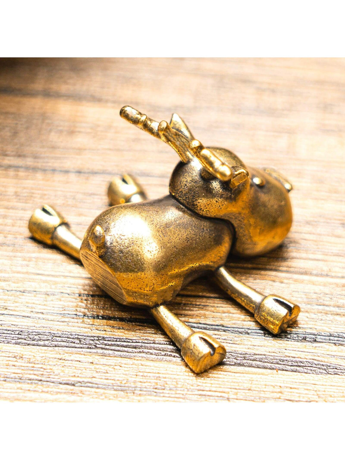 This vintage brass mini reindeer statue is the perfect addition to your winter decor. With its festive design, it adds an enchanting touch to any home or office space. Crafted with high-quality materials, this statue is durable and long-lasting. Elevate your holiday decor with this charming reindeer statue.