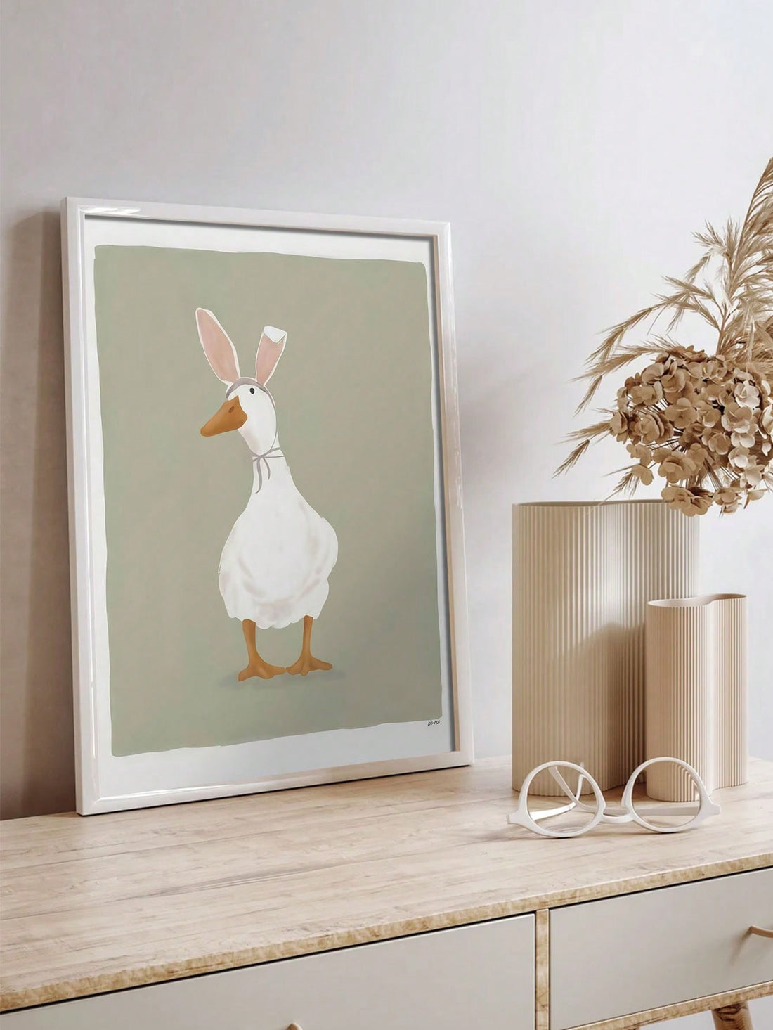 This Whimsical Easter Charm canvas poster features a vintage duck and bunny ears, adding a playful touch to your home décor. The unframed design allows for easy customization and the high-quality canvas material ensures long-lasting durability.