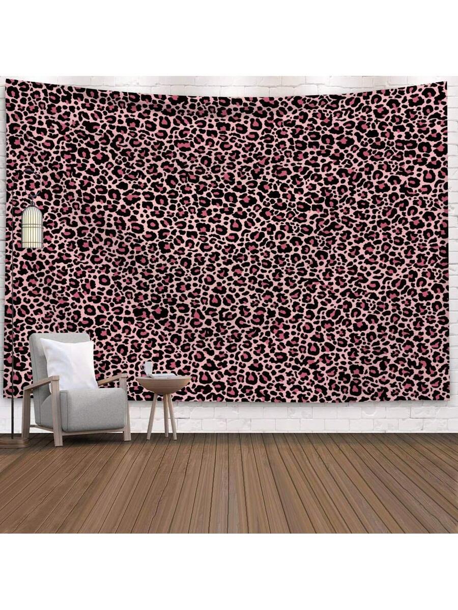 Pink leopard print tapestry with black spots shown as bold bedroom wall decor