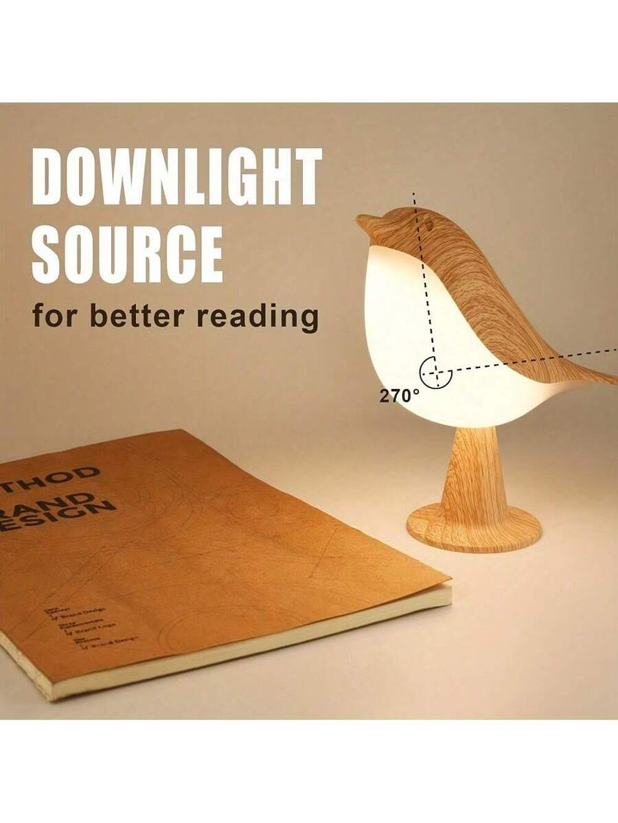 Bird shaped night light on books with glowing white diffuser and wood grain shell.