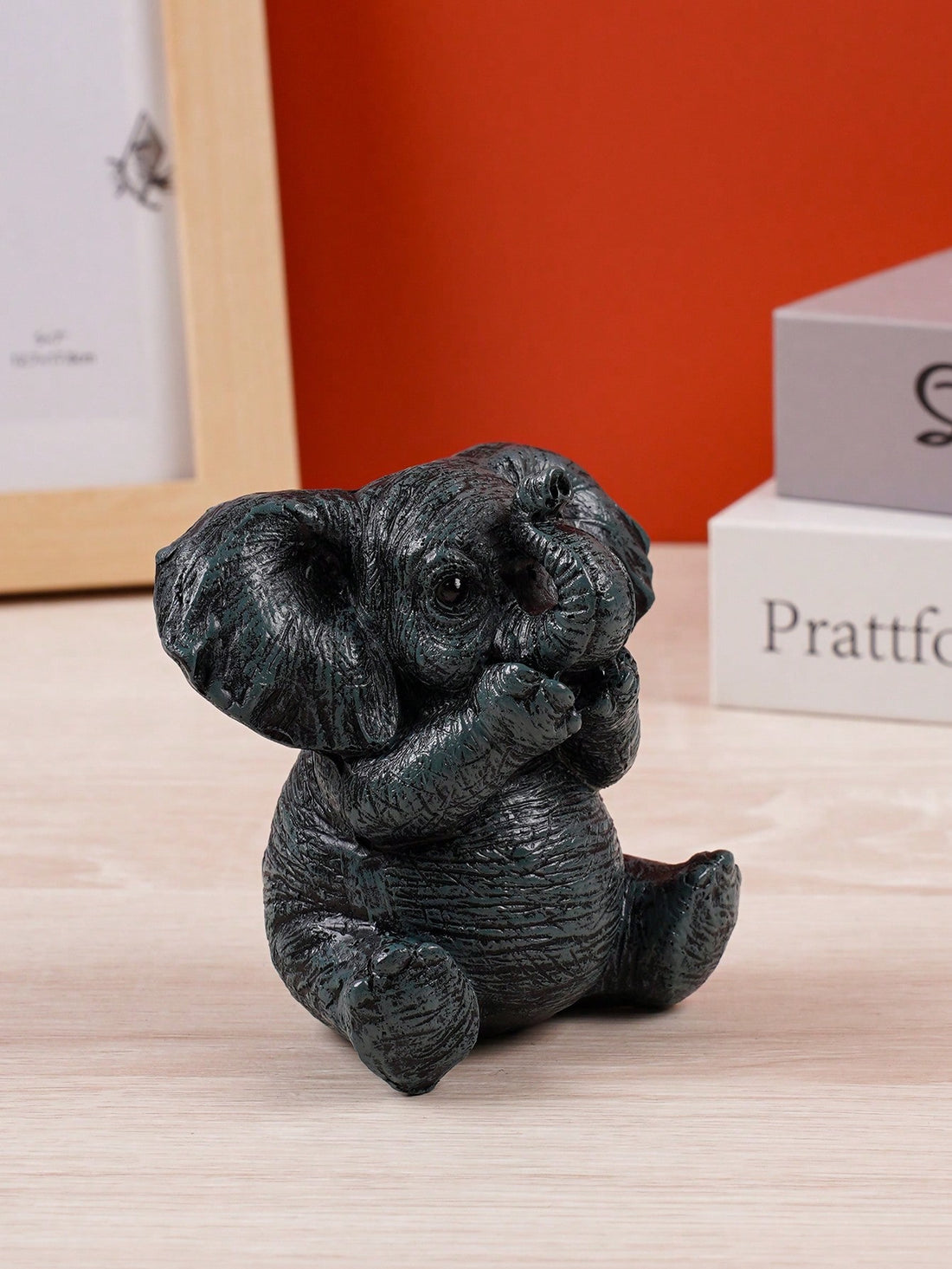 This charming black elephant resin decor is the perfect addition to any office, home, or garden. With its elegant design and versatile use, it adds a touch of sophistication to any space. Made from high-quality resin, it is durable and long-lasting. Elevate your decor with this charming piece today!