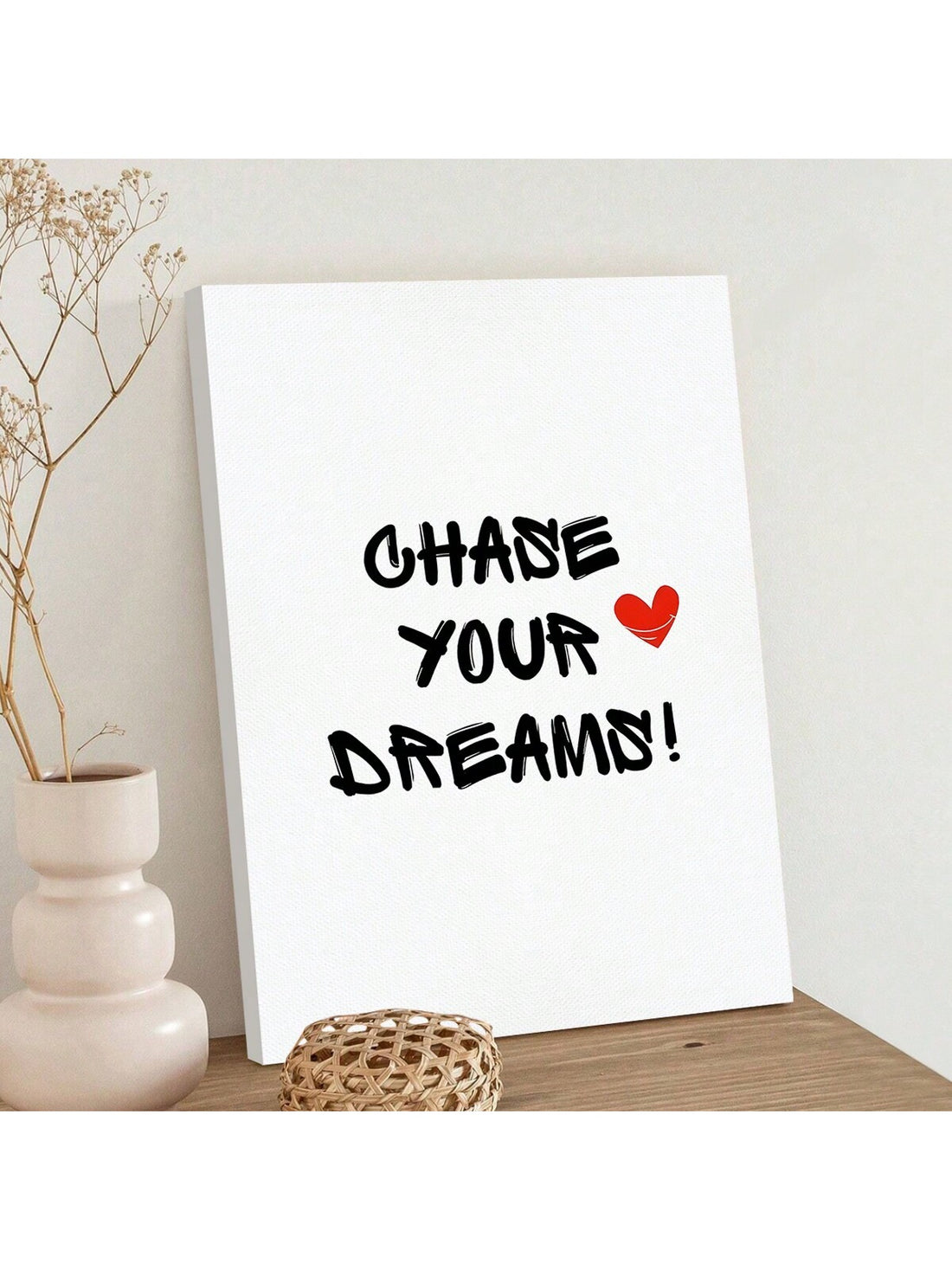 Add a touch of inspiration to your space with our "Chase Your Dreams" canvas wall art. Perfect for both home and office decor, this piece combines beautiful design with motivational messaging to help you stay focused on your goals. Let this canvas remind you to never give up on your dreams.