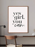 Wood framed Yes Girl You Can wall art above a minimalist study desk