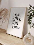 Yes Girl You Can typography print in a light wood frame beside botanical decor