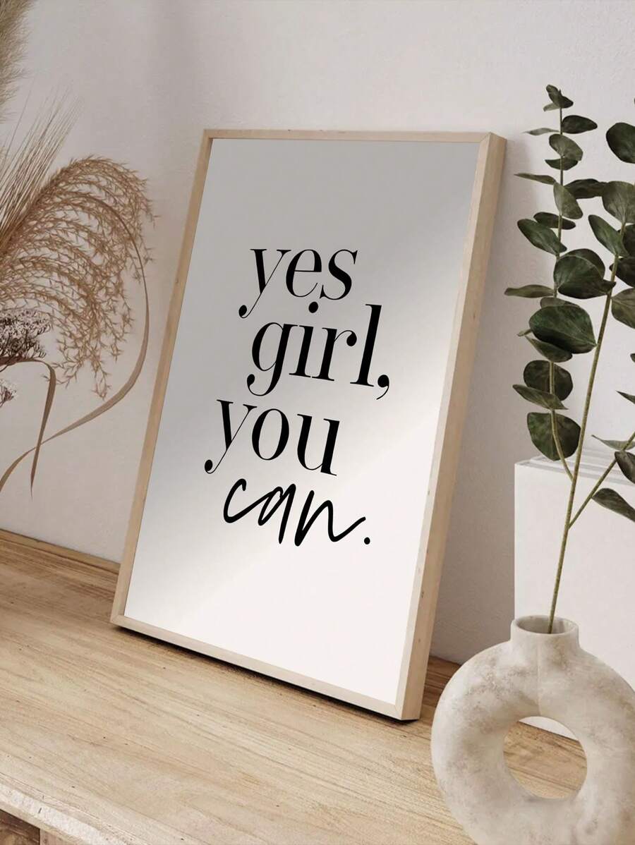 Yes Girl You Can typography print in a light wood frame beside botanical decor
