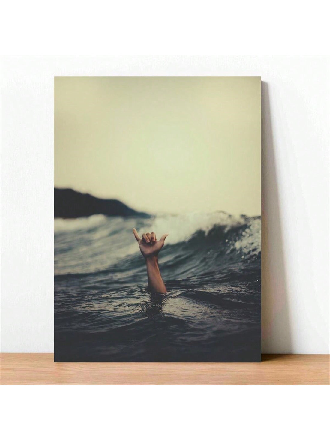 Transform any space with our vibrant Surfer's Hand Gesture Canvas Art Print! This inspirational ocean wave decor will add a touch of energy and motivation to your home or office. Made with high-quality materials, this print captures the dynamic spirit of surfing while showcasing the beauty of the ocean. Elevate your space with this stunning art piece.