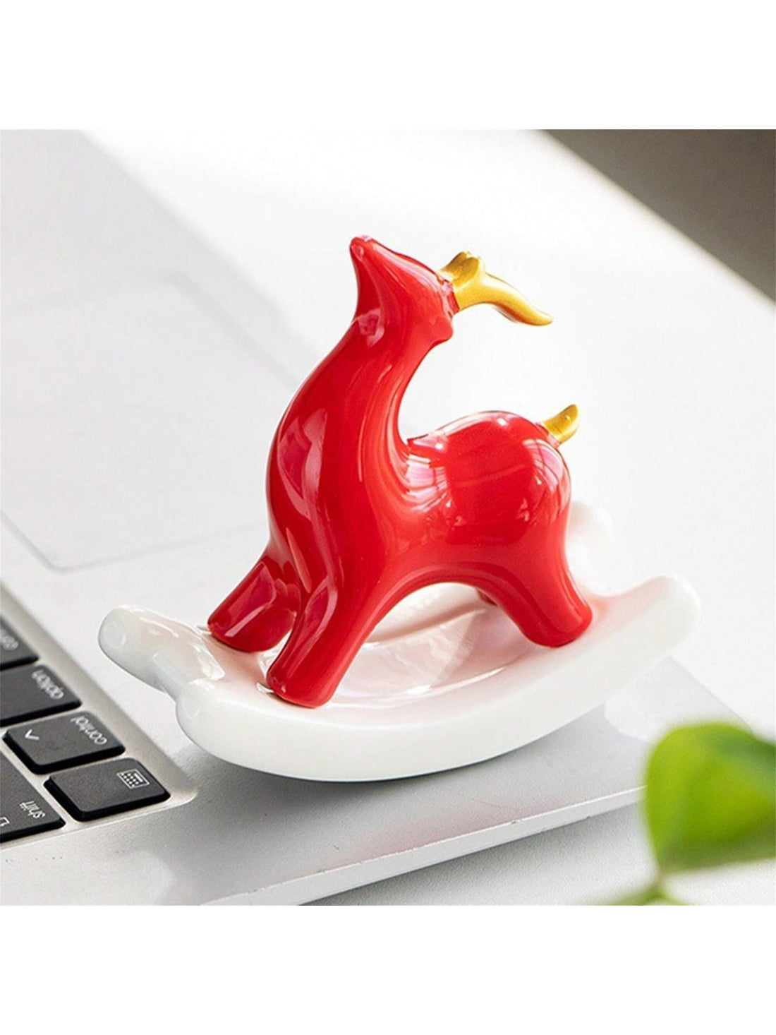 The Charming Ceramic Swing Reindeer is the perfect desk decor for bringing Christmas cheer to your workspace. Made of ceramic, this reindeer adds a touch of charm to any desk or shelf. Its festive swing design captures the holiday spirit and is sure to delight both children and adults alike.