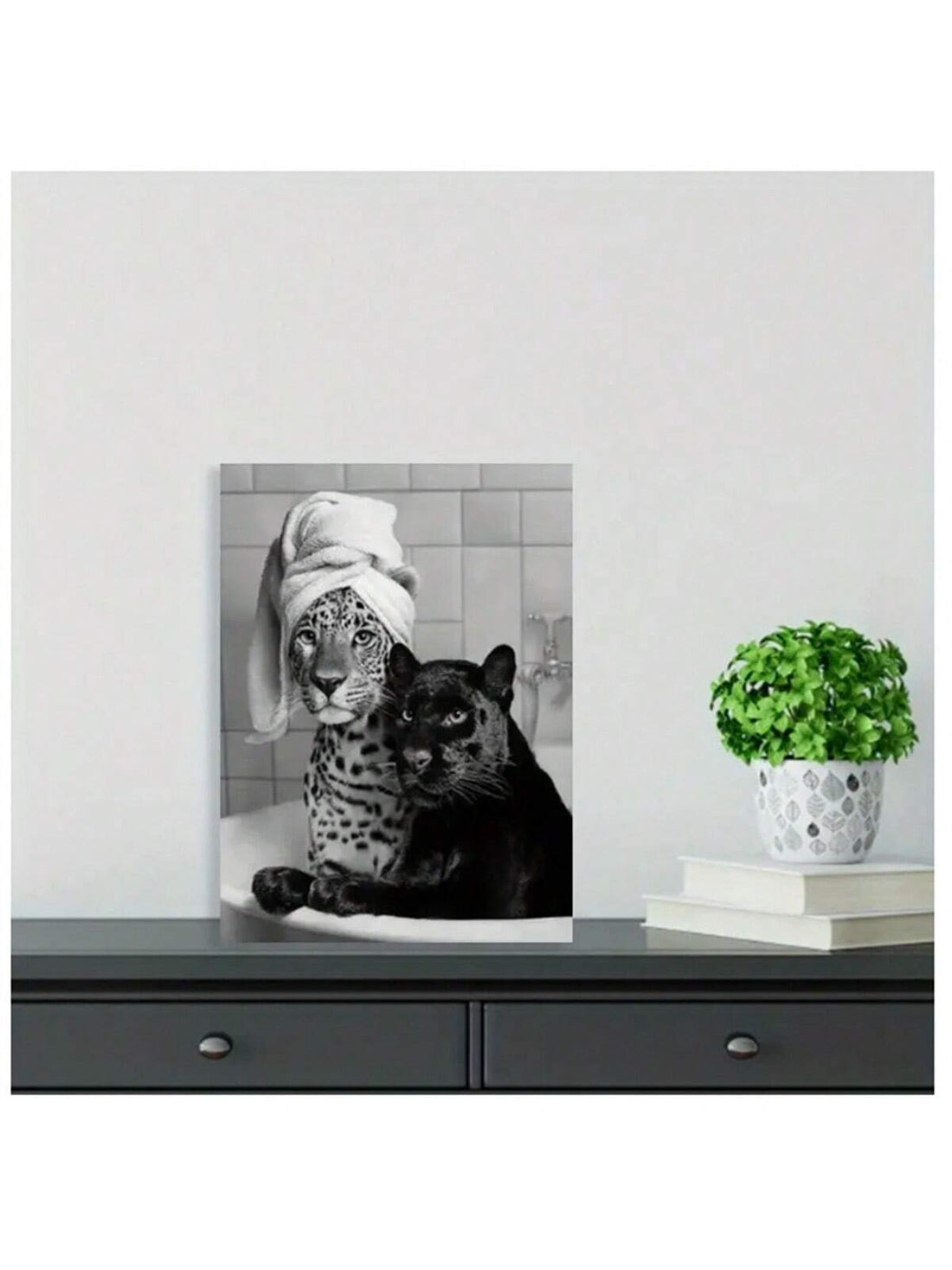 This vintage chic wall art print features a charming depiction of leopard and panther cubs in a bathtub. This playful and adorable print is sure to add a touch of whimsy to any room. Made with high-quality materials, this print is a must-have for animal lovers and art enthusiasts alike.
