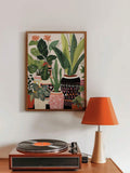 Colorful indoor plant print above record player in retro living room