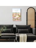 Christian scripture canvas with pastel wildflower landscape hanging above dark sofa near room divider