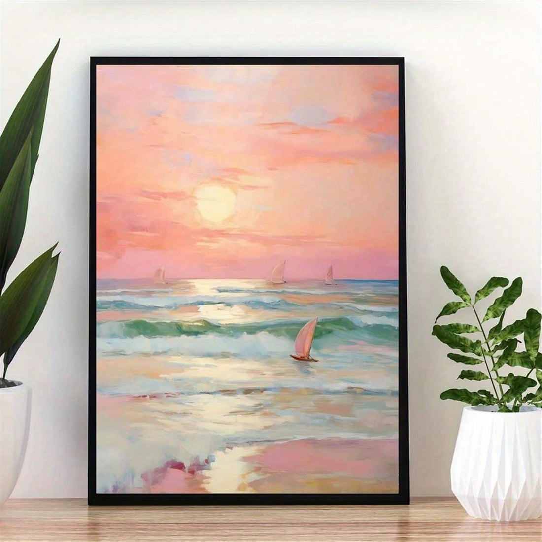 Elevate your living space with this frameless wall art featuring an abstract watercolor of a pink sunset over beach waves and a sailboat. Its soft hues and fluid design bring a serene, coastal ambiance to any room, perfect for those seeking sophisticated, calming decor. The frameless style offers a modern, minimalist touch that seamlessly integrates with various interior themes.