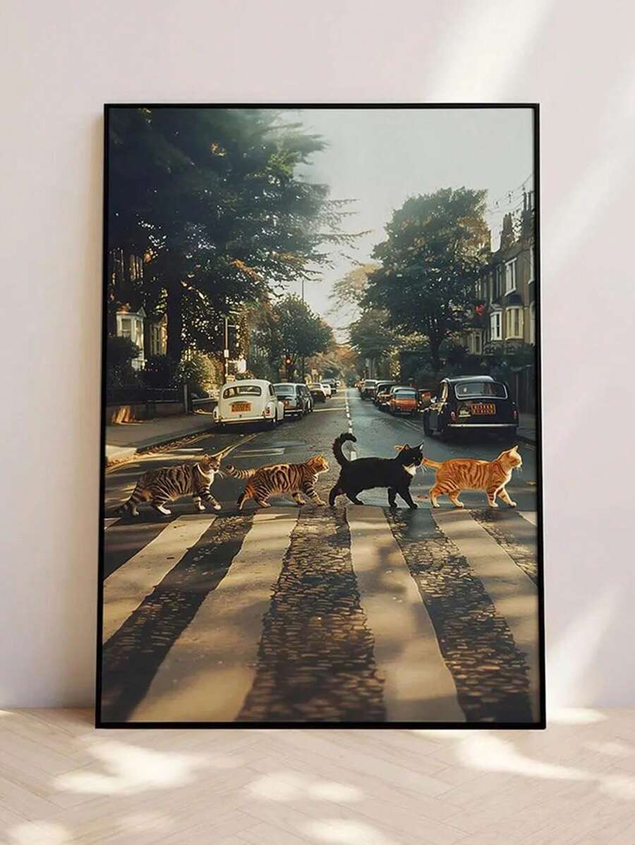 Large black framed print of cats crossing city street