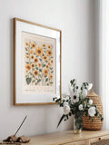 Framed London flower market sunflower print above a wooden console
