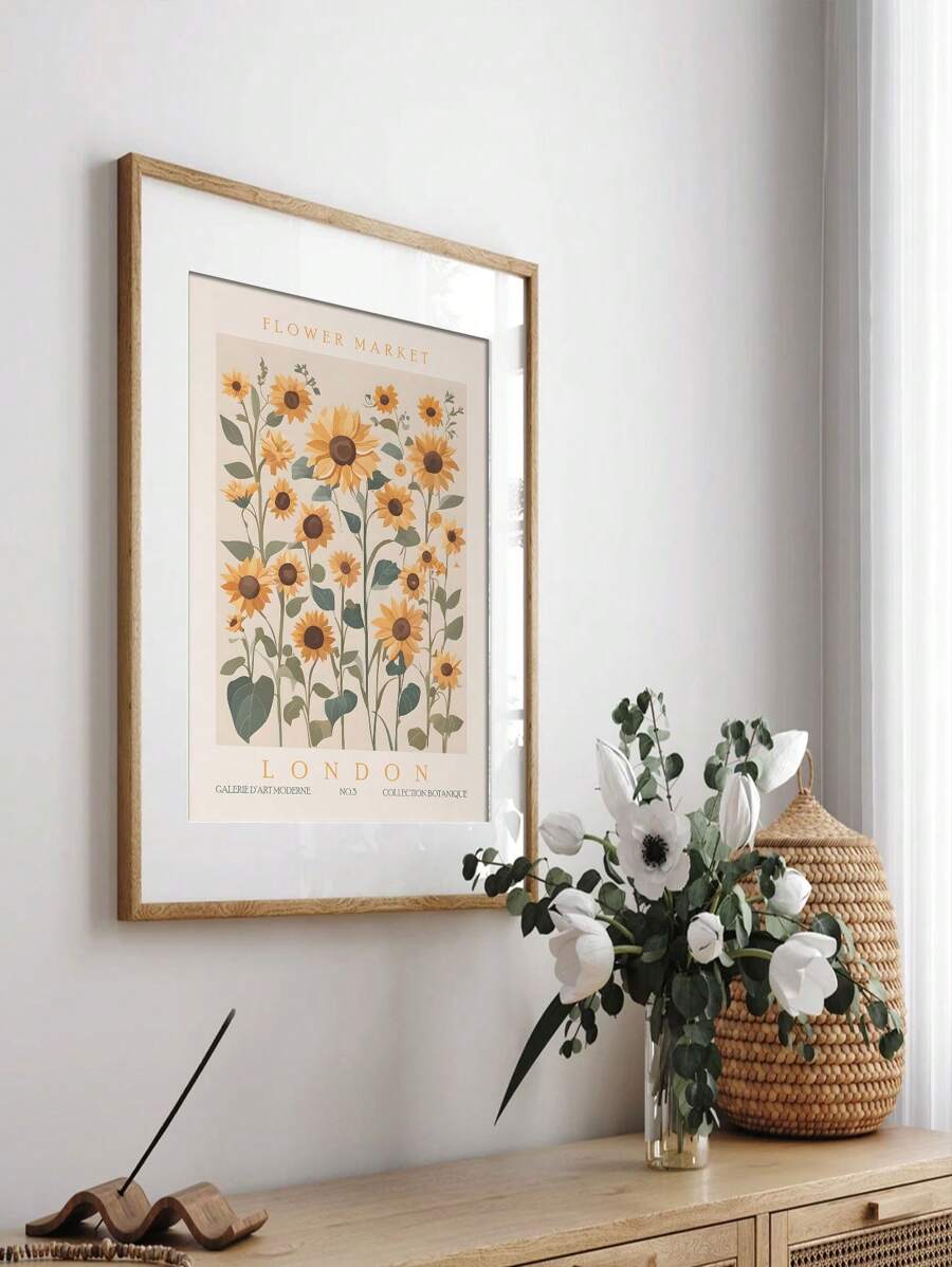 Framed London flower market sunflower print above a wooden console