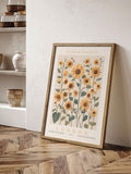 London sunflower botanical print in a wood frame on parquet flooring