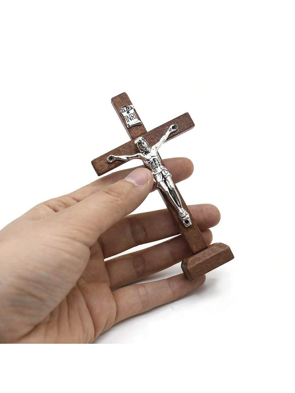 This handcrafted wooden cross base decor is a beautiful addition to any stylish living room or home. Made from natural wood, it adds a touch of warmth and sophistication to any space. Enhance your home with this elegant and timeless ornament.