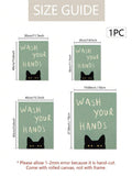 WASH YOUR HANDS cat wall art above a white console on herringbone floor