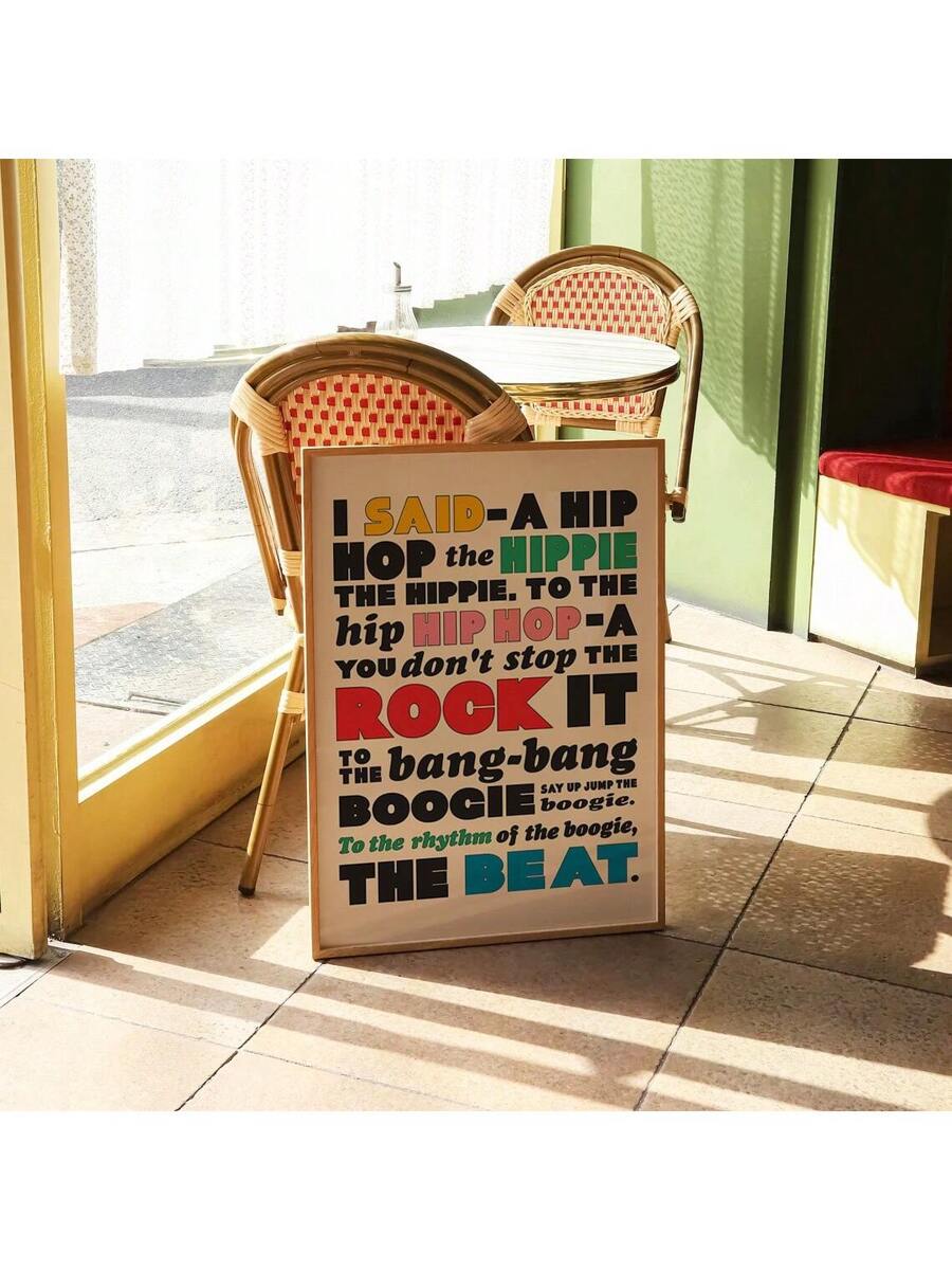 Colorful framed hip hop lyric wall art in a sunlit patio room