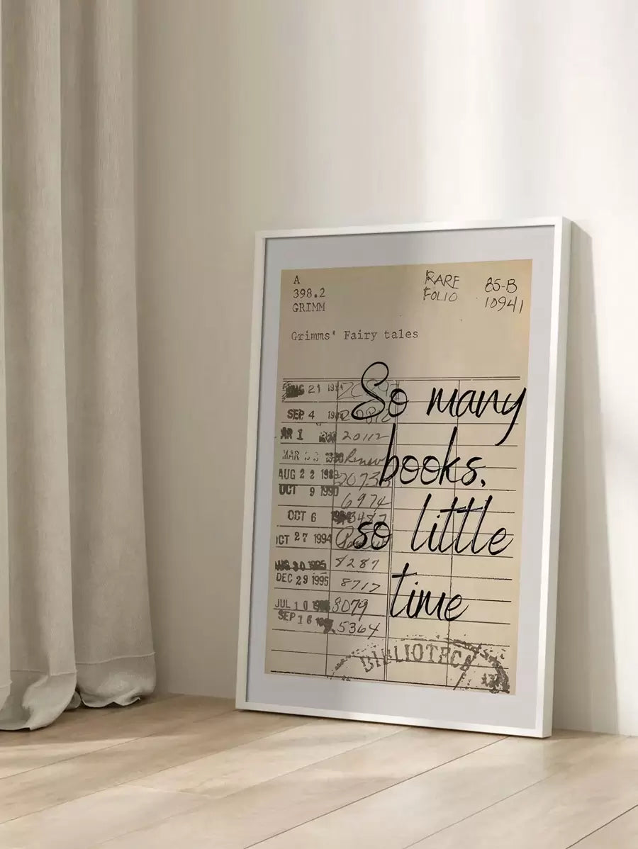 White framed vintage library card quote print in a sunlit interior