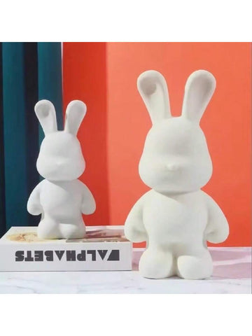 This DIY Fluidal Graffiti Rabbit Piggy Bank combines creativity and functionality, making it the perfect addition to any home decor. With a white base and fluidal graffiti design, this rabbit figurine adds a touch of uniqueness to your space. Use it as a piggy bank to save money or as a decorative piece.