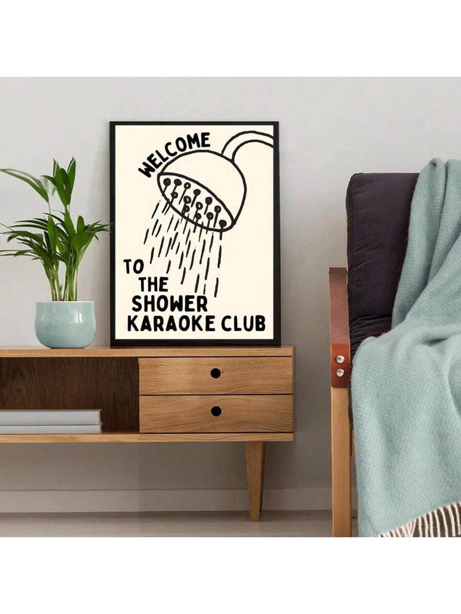 Playful shower karaoke poster in black frame beside plants