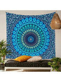Bright blue teal mandala tapestry behind bench with plants