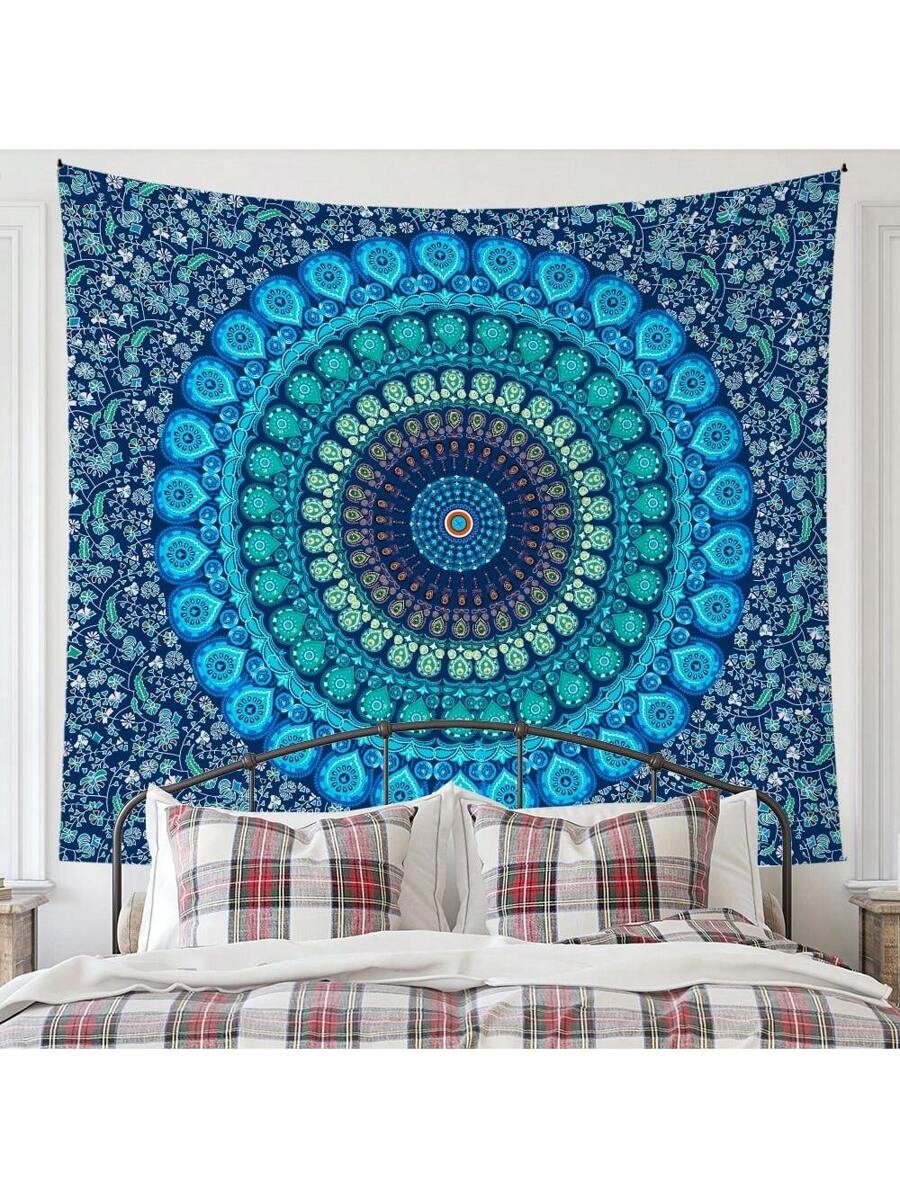 Navy blue and teal mandala tapestry hanging behind bed
