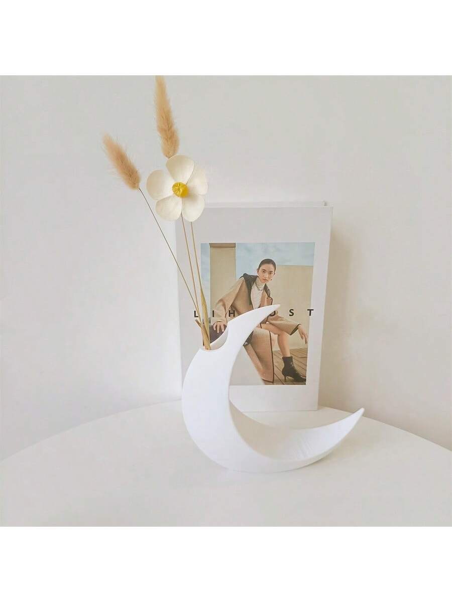 This Gothic 3D Printed Moon-Shaped Flower Vase is the perfect addition to your Halloween and year-round home decor. Crafted with intricate details and a unique shape, this vase adds a touch of elegance and spookiness to any room. Made with high-quality materials, it's durable and long-lasting.