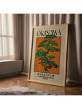 Framed Okinawa Board of Tourism landscape print beside curtains and natural wood