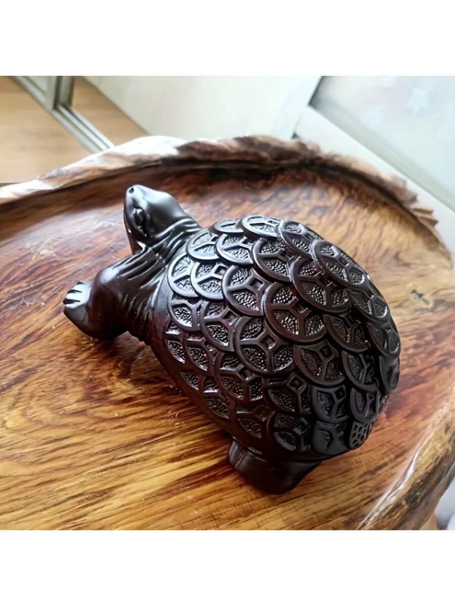Elevate your home decor with our Hand-Carved Ebony Money Turtle Sculpture. This elegant Feng Shui wooden decor piece is expertly crafted to bring positive energy and abundance to any space. Made from high-quality ebony wood, this intricate turtle sculpture is a beautiful and beneficial addition to your home.