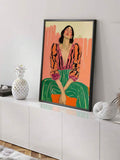 Black framed colorful woman portrait on white sideboard